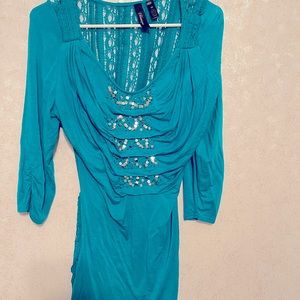 Size M turquoise womens blouse like new.